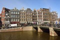 View of Leliegracht bridge spanning Prinsengracht canal in Amsterdam. Royalty Free Stock Photo